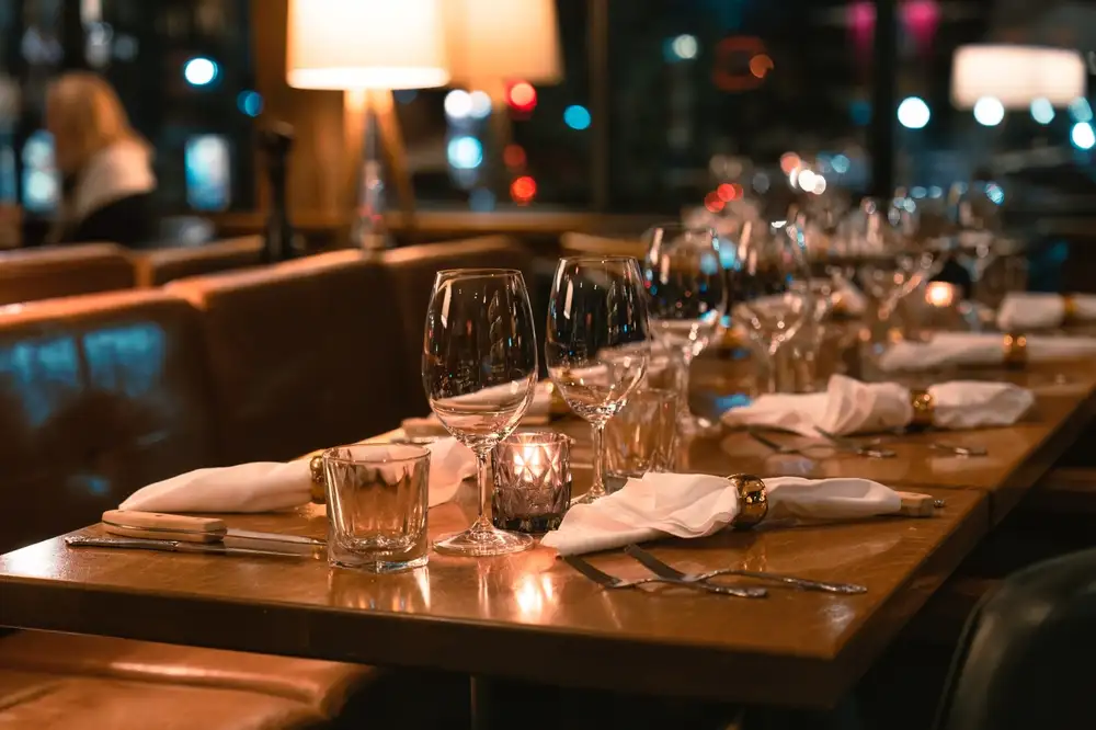 80% of diners prefer to book online, making a restaurant reservation system like TableIn essential for small or independent restaurants. This image shows tables that have been rearranged to accommodate a large group of diners at a restaurant that uses an online restaurant reservation system.